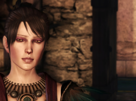 Morrigan stands in a castle room, fire-lit. There is a doorway behind her