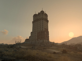 A screenshot from Fallout 3. Tenpenny Tower in the distance, with the sun setting in the background.