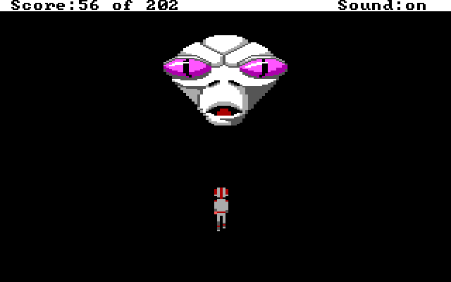 Roger stands before a giant white alien head.