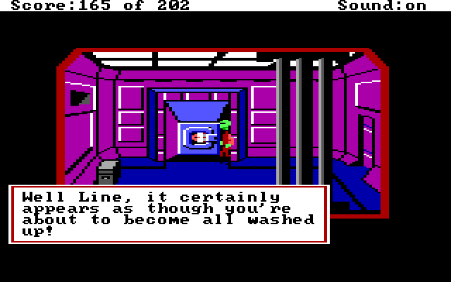 On the alien ship. Roger is in a washing machine. Game text: "Well Line, it certainly appears as though you're about to become all washed up."