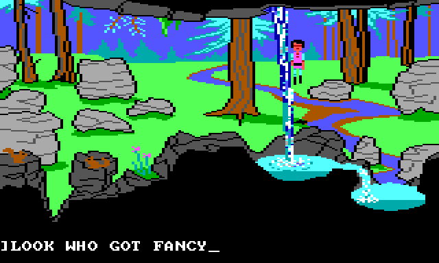 Gwydion stands outside by a waterfall. There are lots of trees and rocks at various depths of field, and a stream runs off into the distance. The waterfall is in the extreme foreground and has a complicated blue-and-white texture. Game text reads: "LOOK WHO GOT FANCY"