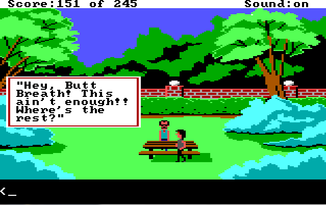 A park filled with trees and large bushes. There is a low brick wall in the background and a picnic table in the foreground. Two white men stand by the picnic table, both wearing tank tops. A dialogue box off to the side reads: "'Hey, Butt Breath! This ain't enough. Where's the rest?'"