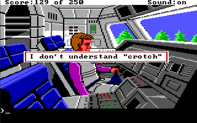 A close-up view of Roger sitting in a space shuttle cockpit. There is a joystick between his legs. Trees are visible outside the window. Game text: "I don't understand 'crotch'"