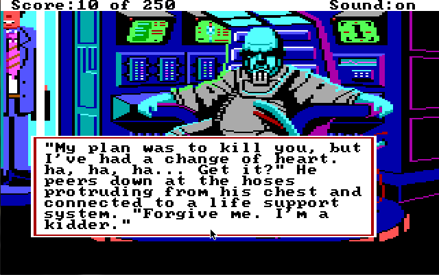 A bald blue man in a gray space suit with some kind of breathing apparatus sits in a chair in front of a wall of screens and electronic equipment. He is scowling. A smiling man in a suit stands in a tube behind him.  Game text reads: "'My plan was to kill you, but I've had a change of heart. ha, ha, ha... Get it?' He peers down at the hoses portruding from his chest and connected to a life support system. 'Forgive me. I'm a kidder.'"