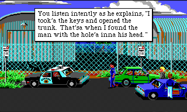 Several cars, including a cop car, are parked by a chain link fence. There are some large rusty warehouses in the background. Sonny stands by his car. There is a dark-haired white cop nearby. Game text reads: "You listen intently as he explains, "I took'a the keys and opened the trunk. That'sa when I found the main with the hole'a inna his head."